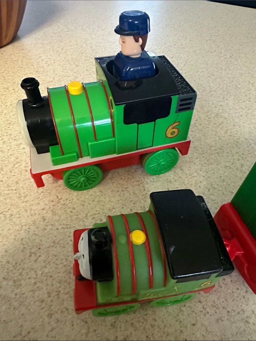 Green Percy the Small Engine toys and cargo cars from Thomas & Friends.